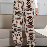 Aztec Pattern Fleece Joggers featuring a cozy ethnic print design in shades of orange and white, tailored for women.