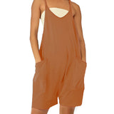 Beige backless summer romper for women, shown in roasted coconut color, featuring a casual style with pockets. The romper is a one-piece garment with a sleeveless design, highlighting the waist and shoulders. The model is standing, showcasing the garment's relaxed fit.