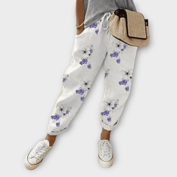 Beige snakeskin leggings featuring a trendy women's fashion jogger style with subtle floral prints, shown in size 3XL.