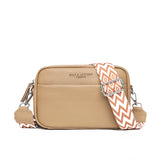 Tan leather crossbody bag with a designer geometric strap, featuring a rectangular shape and elegant design suitable for travel and everyday use.