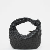 Black leather geometric woven handbag with braided design and shoulder strap, featuring a stylish and modern look for fashion-forward individuals.