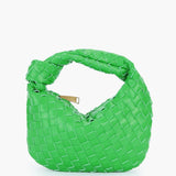 Black leather geometric woven handbag in a rectangular shape with a braided shoulder strap, featuring a green color variant and designer pattern.