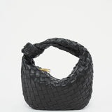 Black leather geometric woven handbag with braided detailing, designed as a shoulder bag.