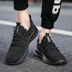 Black running sneakers for men with a lightweight and breathable design, shown in size 43, featuring a sleek black color with non-slip soles, ideal for sportswear and fashion.