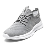 Light gray running sneakers for men, designed for outdoor activities, featuring a lightweight and breathable construction with a non-slip sole, size 43.