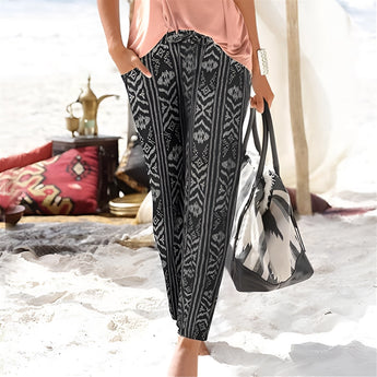 Bohemian Beach Pants featuring a tribal print in black and white, designed for women. Displayed in size 2XL, the trousers are styled for summer wear, showcasing a comfortable fit and bohemian flair.