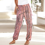 Bohemian Beach Pants featuring a black and white tribal print on lightweight fabric, styled as relaxed-fit women's summer trousers. The pants are displayed in pink with a 2XL size, showcasing their comfortable fit around the waist, hips, and thighs.