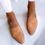 Brown woven leather loafers for women in a beige color, featuring a stylish slip-on design.