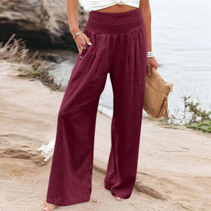 Women's wide-leg flowy summer palazzo pants in burgundy, showcasing a bohemian style. The pants are depicted in a red color, size 3XL, featuring a high waist, roomy thigh area, and reaching down to cover the knees, illustrating a comfortable and stylish fit.