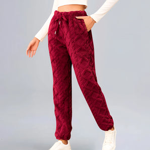 Burgundy cable knit sweatpants for women, featuring a cozy textured design with a focus on comfort and style, showcasing a vibrant violet color.