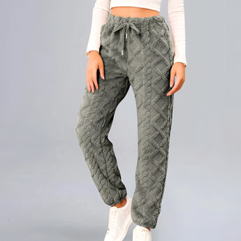 Gray cable knit sweatpants for women with a cozy textured design, shown in a standing position, showcasing the joggers' waistband and comfortable fit in size 2XL.