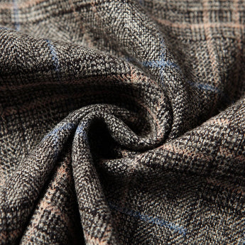 Men’s herringbone wool tweed blazer in a tailored fit, featuring a brown and grey woven pattern.