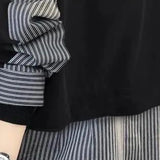 Modern asymmetrical women's jacket with black and white stripes, featuring a distinctive design with emphasis on areas like the neck, sleeves, waist, and elbows, highlighting comfort and style.