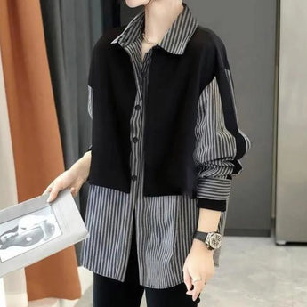 Modern asymmetrical women's jacket with black and white stripes, featuring a unique design with a focus on fashion, shown in the color black, size XL.