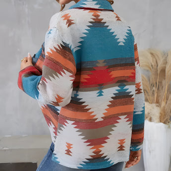 Southwestern Aztec print women's denim jacket featuring a boho fall fashion style, with vibrant patterns in shades of orange, azure, and aqua, showcasing a collar, long sleeves, and a waist-length cut.