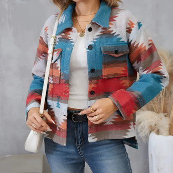 Southwestern Aztec print women's denim jacket featuring a boho fall fashion style, with vibrant orange and white patterns, long sleeves, and a classic denim texture.