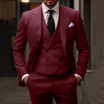 A stylish double-breasted charcoal slim-fit men's suit styled with a white dress shirt and burgundy tie, showcasing formal wear perfect for business and wedding occasions.