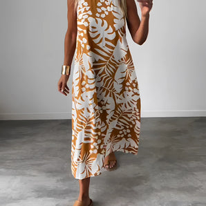 A woman wearing a Tropical Print Sleeveless Midi Dress in orange, size 3XL, featuring a boho chic design suitable for beachwear.