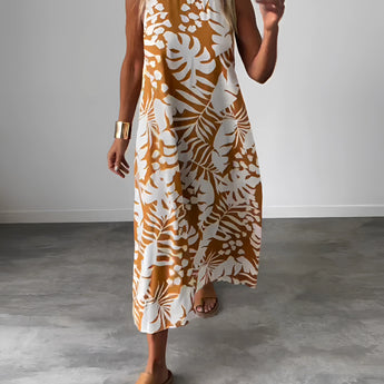 A woman wearing a Tropical Print Sleeveless Midi Dress in orange, size 3XL, featuring a boho chic design suitable for beachwear.