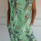 Green tropical print sleeveless shift dress for women, featuring a relaxed fit perfect for summer beachwear, shown in size 3XL.