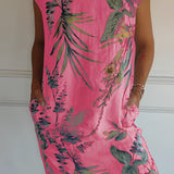 
A tropical print sleeveless shift dress for women, designed for summer beachwear, in a pink color and size 3XL. The dress features a vibrant tropical pattern and a relaxed fit, ideal for warm weather occasions.