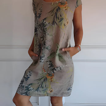 Tropical white botanical print summer shift dress for women featuring floral patterns, shown in brown color and size 3XL, highlighting the dress's one-piece design with visible sleeves, neckline, and hem.