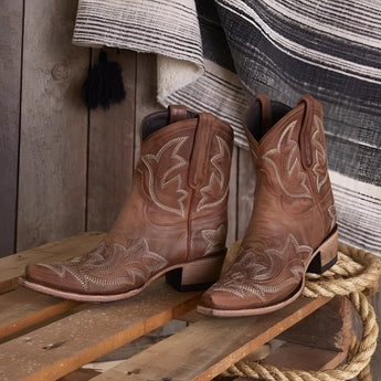 Turquoise suede women's cowboy boots with intricate western embroidery, showcased in a brown color variant.