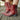 Turquoise suede cowboy boots for women featuring intricate western embroidery, shown in a red color variant in a size 43, styled outdoors on a wooden surface with a focus on the lower leg displaying the boots' fit and fashion appeal.