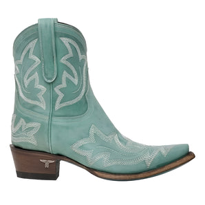 Turquoise suede cowboy boots for women featuring intricate embroidery, showcasing a vibrant western fashion style.