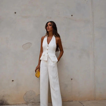 White backless jumpsuit for women, designed for formal and elegant evening wear, featuring a sleek and sophisticated fit.