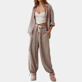 White fluffy jumpsuit for women in a cozy plush fabric, featuring long sleeves, a defined waist, and a collar design, shown in a rose color and XL size.