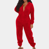 
A woman wearing a red, fluffy jumpsuit in an XL size, featuring long sleeves and a cozy plush texture. The jumpsuit has a casual yet fashionable design, with a comfortable waist and a stylish collar, suitable for winter wear.