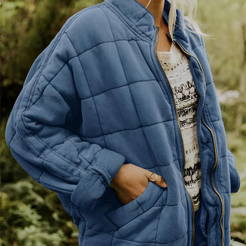 
A blue women's lightweight insulated quilted jacket in size 2XL, featuring a collar, long sleeves, and a waist-length design.