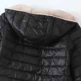 Women's lightweight insulated water-resistant puffer jacket displayed on a hanger against a plain background, showcasing its quilted pattern and sleek design.