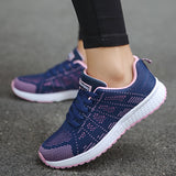 Women's pink lightweight sneakers designed for running, featuring breathable material, displayed alongside casual attire including jeans and sportswear.